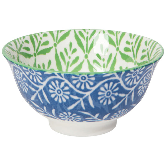 Ceramic bowl with blue and green floral patterns on a white background